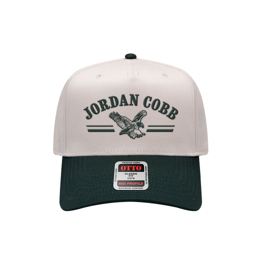 Eagle and 'Jordan Cobb' embroidered on the front of a twill hat in green/natural